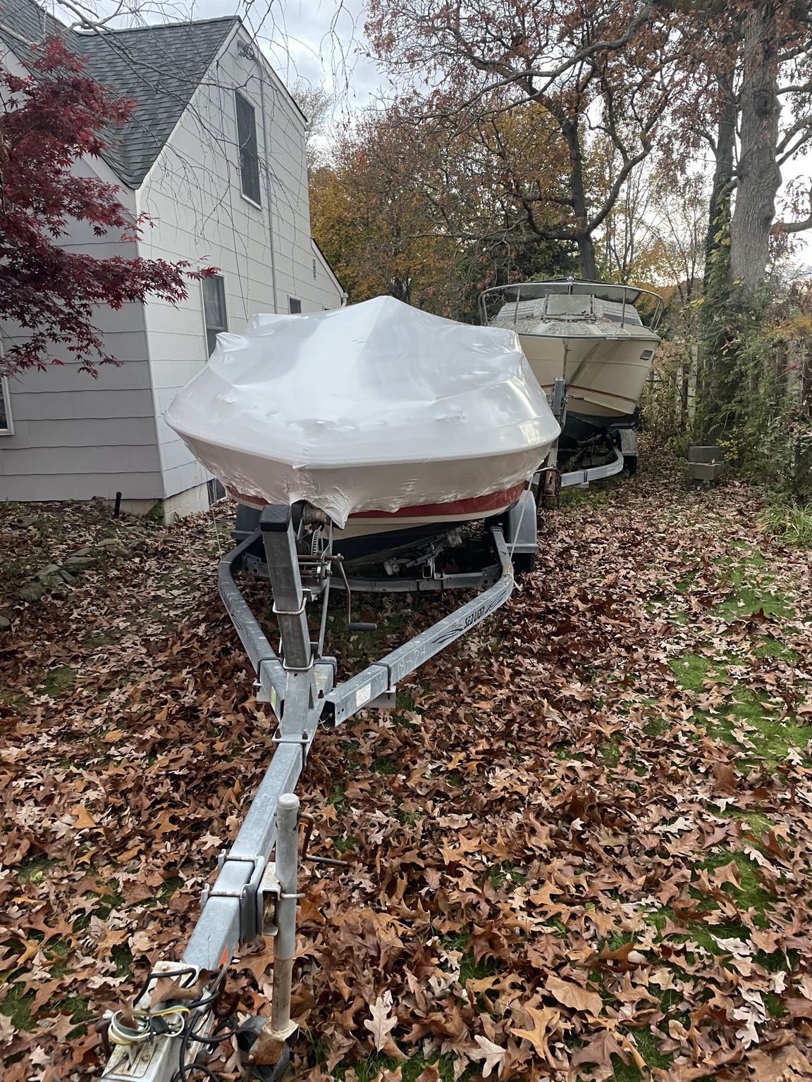 Boat shrink wrapping on trailer