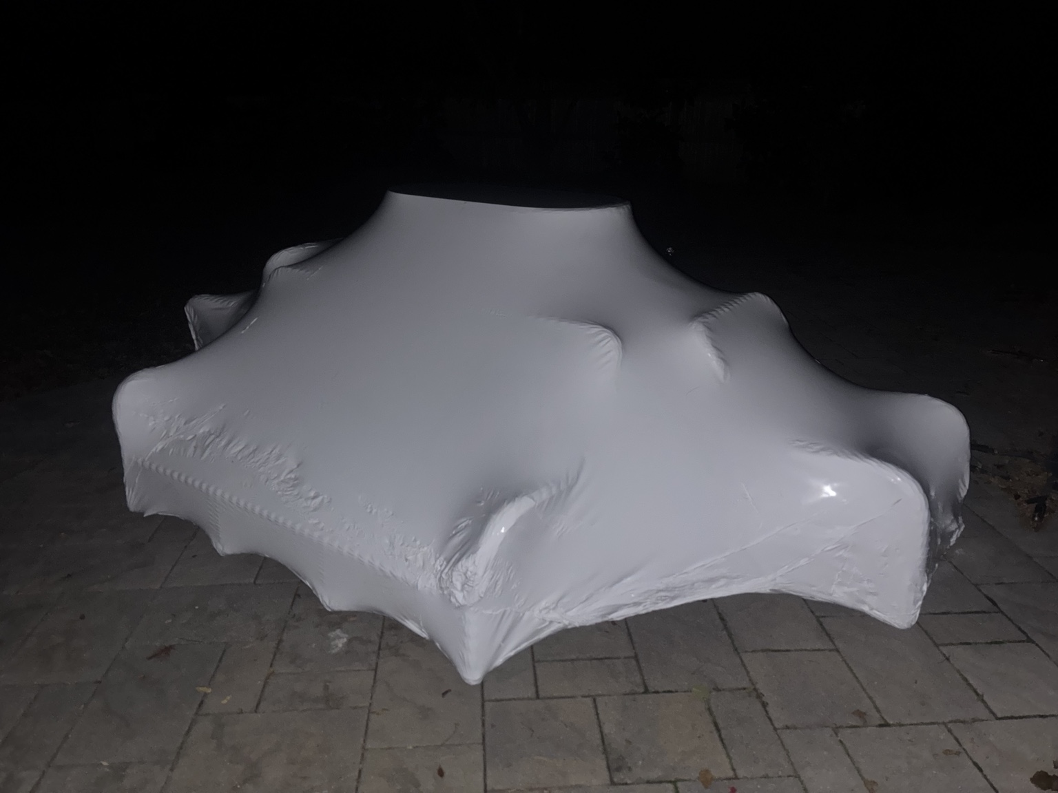 Patio furniture shrink wrapped at night